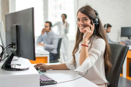 A phone operator in a freight broker office